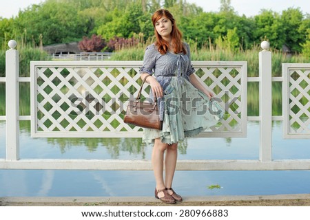 girl at a pond, girl with a vintage bag