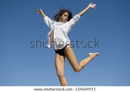 Young woman jump free in the sky