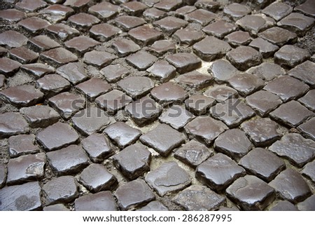 old cobblestone road as background