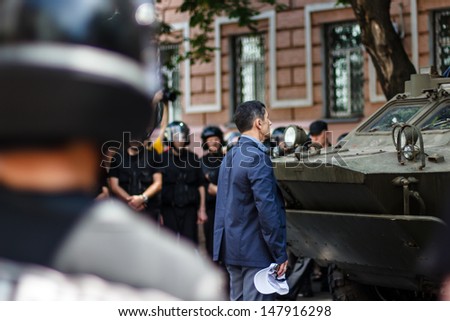KIEV, UKRAINE - MAY 18: Unidentified protester try to stop provocation - moving of  armored military vehicle in  \