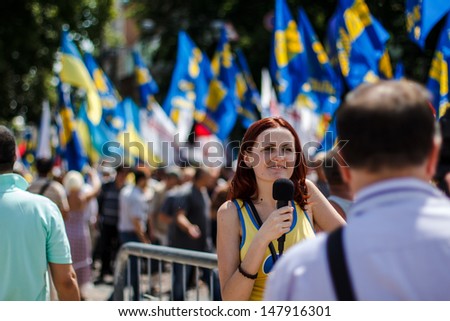KIEV, UKRAINE - MAY 18: Unidentified journalist makes report with protesters of \