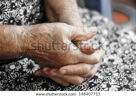 Hands of the old woman. Senior\'s hands. Hands of an 82-year-old woman resting on lap