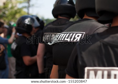 group of ukrainian riot policemen wearing protective vest and helmet.