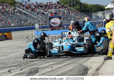 Milwaukee Wisconsin, USA - August 17, 2014: Verizon Indycar Series Indyfest 250 pit stop action. 27 James Hinchcliffe Toronto, Canada United Fiber & Data Honda Andretti Autosport, fuel and new tires