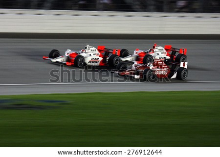 Joliet Illinois, USA - August 29, 2009: IndyCar Racing League. Nighttime Race action on track, cars running wheel to wheel, Chicagoland speedway.