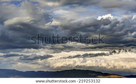 Storm Clouds over Mountain Range mean Rain and Poor Weather.