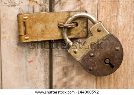 Old master key with wooden door at Chiengkarn