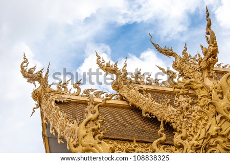 Element of Thai Art, decoration with golden dragons on roof at Wat  Rong Khun, the famous Thai temple at Chiangrai province in Thailand.