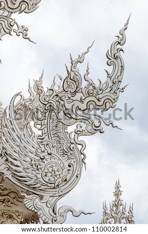 Element of Thai Art, decoration with white dragon on roof at Wat  Rong Khun, the famous Thai temple at Chiangrai province in Thailand.