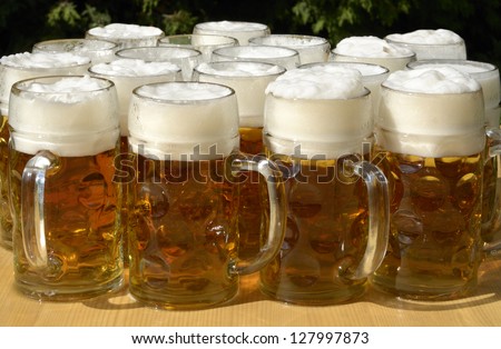 Beer jugs on wooden desk, outdoor