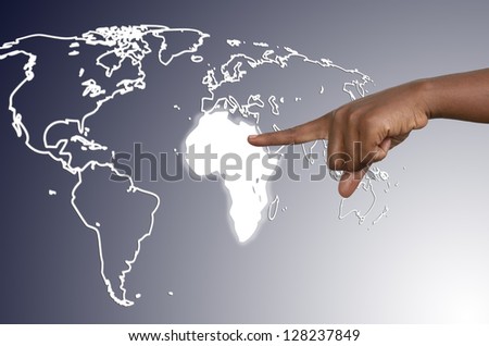 African hand touching map of africa on virtual touchscreen, studio shot