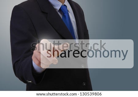 Businessman touching shareconomy word, studio shot, montage