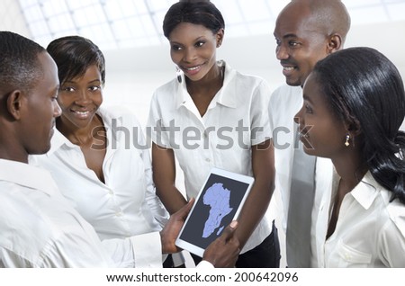 African business team discussing with tablet PC, Studio Shot