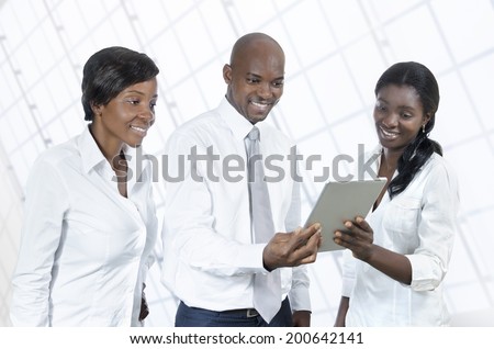 Three african business people with tablet PC, Studio Shot