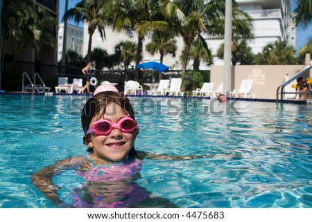 A girl swims in the pool to beat the Florida summer heat.
