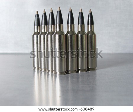 Silver bullets standing in a vee formation.