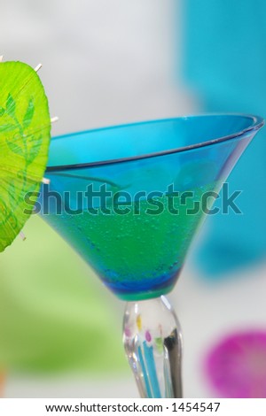 A fizzy drink in a bright blue glass.