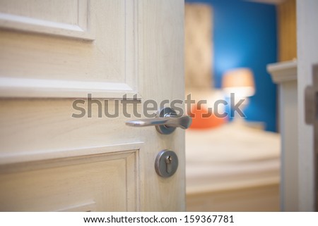 Half-Open Door Of A Bedroom