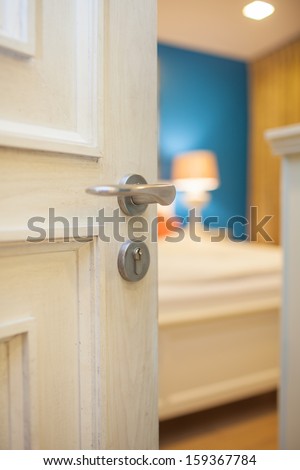 half-open door of a bedroom