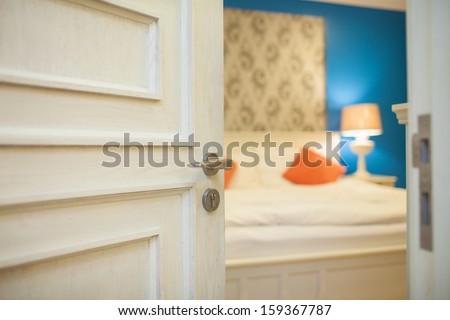 Half-Open Door Of A Bedroom