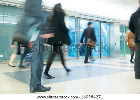 Blur Movement Business people walking in Rush Hour train station, London, UK
