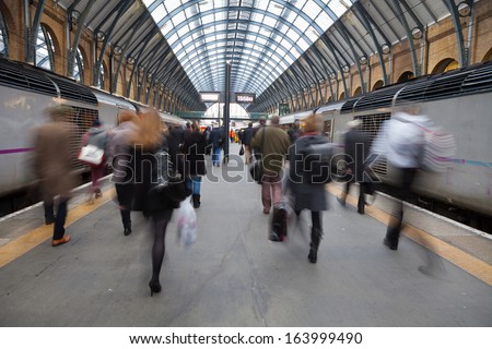 London Train station Blur people movement in rush hour, King Cross station