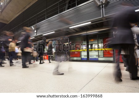 London tube train station people movement in rush hour
