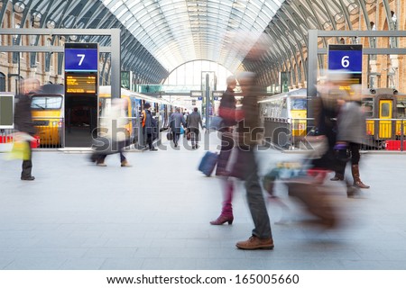 London Train Tube station Blur people movement in rush hour, at King\'s Cross station, England, UK