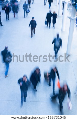 London Train Tube station Blur people movement in rush hour at King\'s Cross station, England, UK