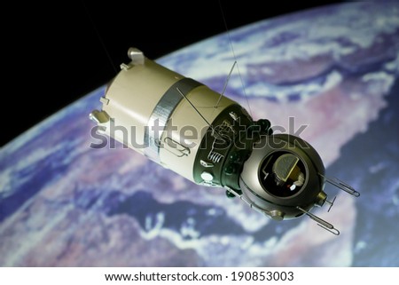 a model of a spaceship rocket with the earth