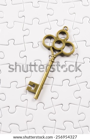 Jigsaw Puzzle with Antique  Key, business concept