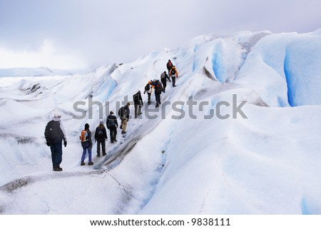 a group of trekking tour on a huge glacier ice in patagonia argentina chile