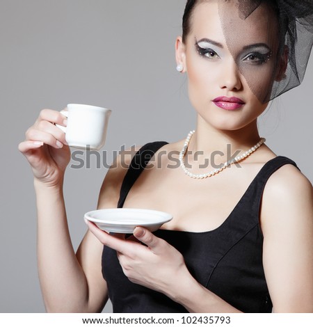 http://image.shutterstock.com/display_pic_with_logo/111616/102435793/stock-photo-beautiful-woman-in-veil-retro-glamour-beauty-portrait-with-cup-of-tea-or-coffee-102435793.jpg