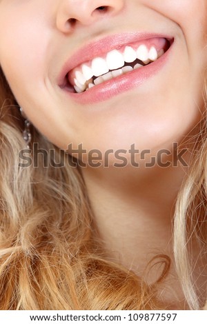 Beautiful smile of young fresh woman with healthy white teeth. Isolated over white background