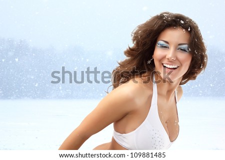 Snow queen - christmas young sexy woman happy smiling, isolated on white background