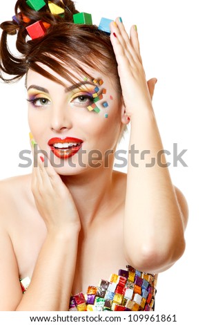 young attractive woman with beautiful art cube abstract make-up isolated on white background