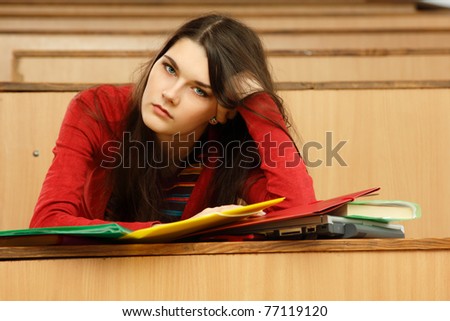 student teen girl educated beautiful tired in empty classroom university