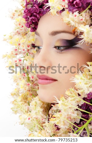 woman beautiful face with flower lilac and chestnut frame