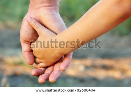 family father and child son hands nature outdoor