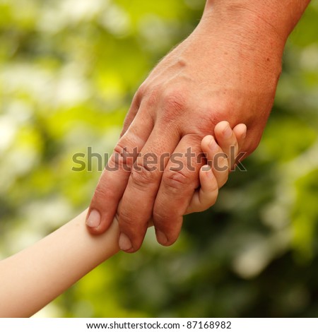 family father and child son hands green nature outdoor