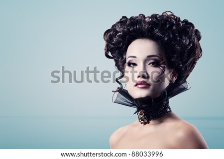 woman beautiful halloween vampire baroque aristocrat over blue background