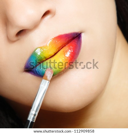 rainbow vivid color lips with brush close up, face detail