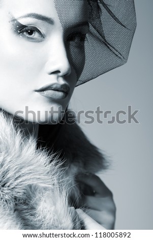 Beautiful woman with veil looking at camera retro glamour beauty portrait, toned