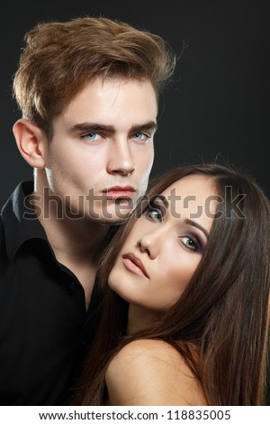Sexy passion couple, beautiful young man and woman closeup, studio shot