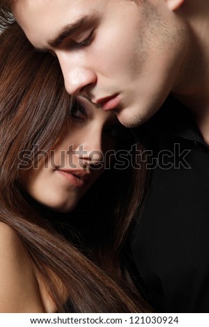 Sexy passion couple, beautiful young man and woman closeup, studio shot - stock photo