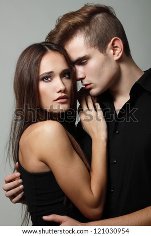 Sexy passion couple, beautiful young man and woman closeup, studio shot