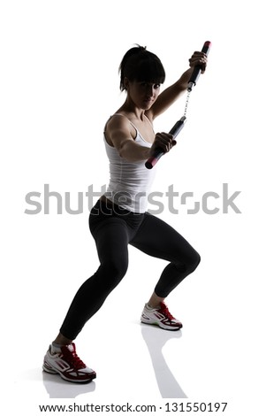 stock-photo-sport-karate-girl-doing-exercise-with-nunchaku-fitness-silhouette-studio-shot-over-white-background-131550197.jpg