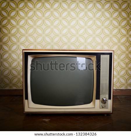 Retro Tv With Wooden Case In Room With Vintage Wallpaper And Parquet