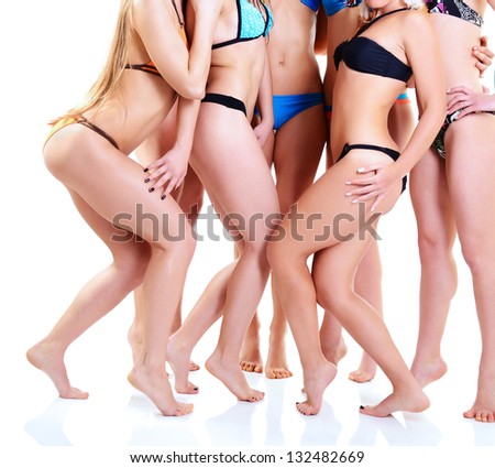 girls in bikini with perfect fit bodies, seven attractive caucasian young women in swimsuits over white