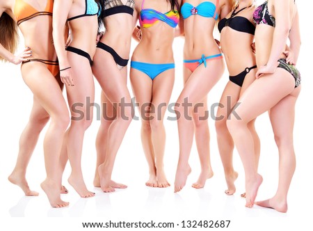 group of girls in bikini, seven attractive caucasian young women in swimsuits over white